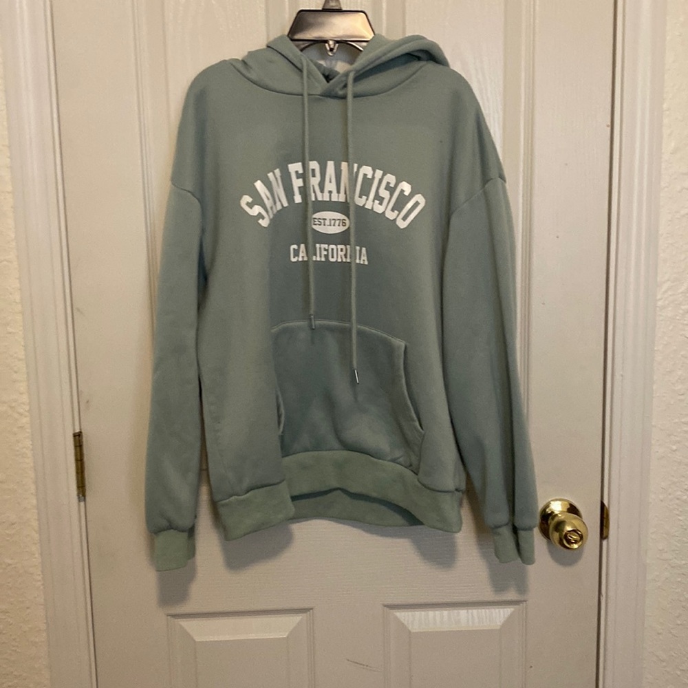 A light green sweatshirt